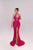 Woman wearing a pink evening gown with a high slit on a white background