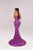 Woman wearing a purple evening gown on a light gray background